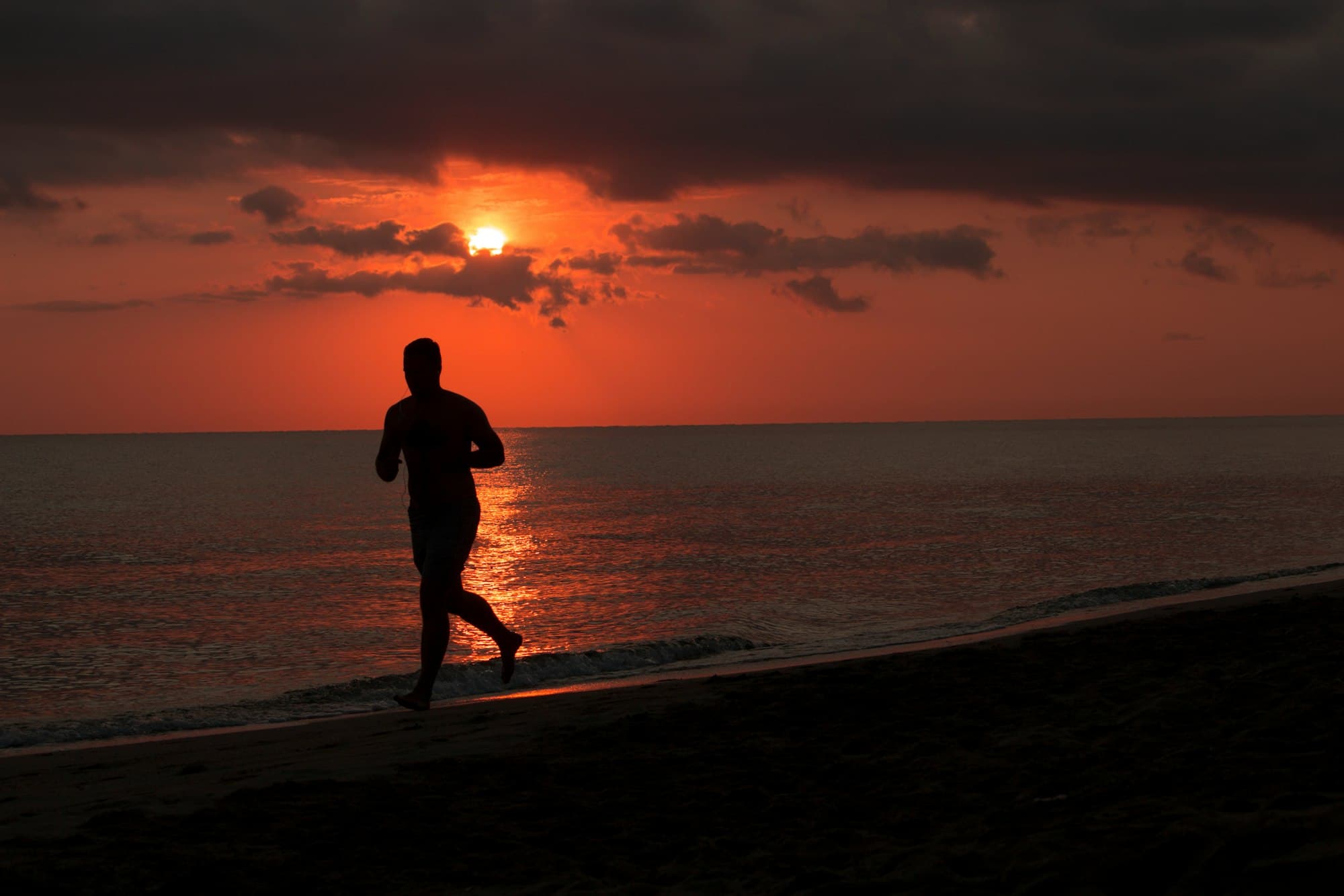 A swimmer pushing off the wall at dawn in a Lagos pool